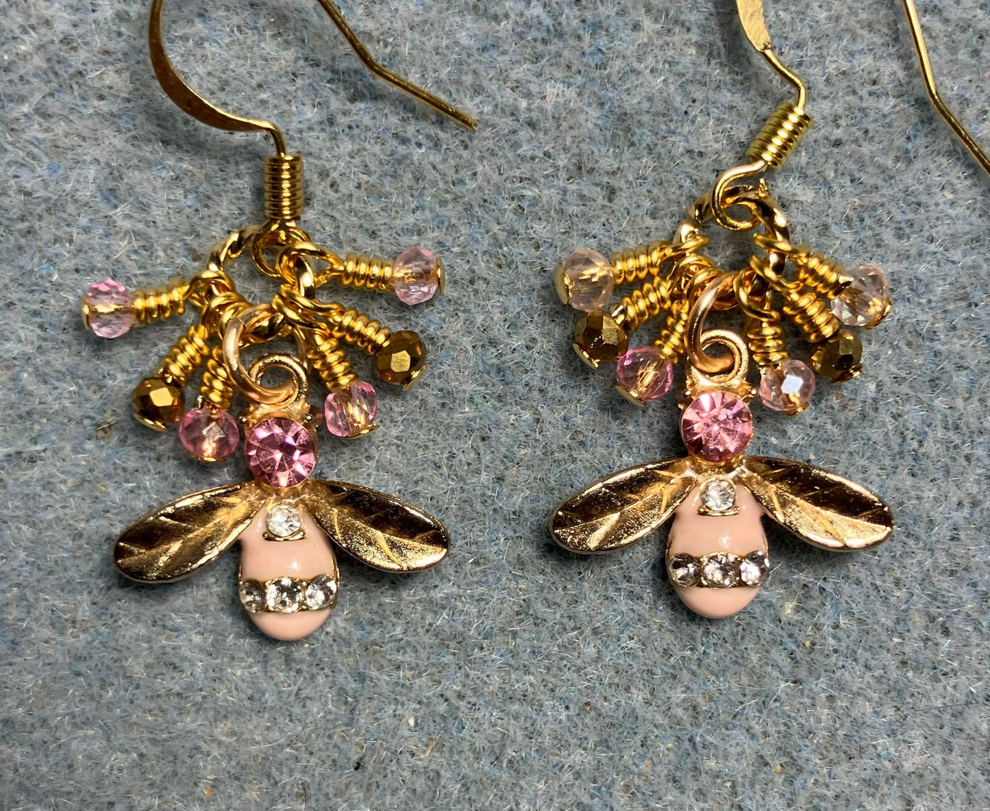 Gold and pink enamel and rhinestone honeybee charm earrings adorned with tiny dangling pink and gold Chinese crystal beads.