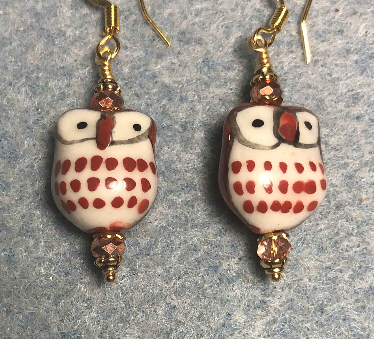 Dark orange and white ceramic spotted owl bead earrings adorned with orange gold Chinese crystal beads.