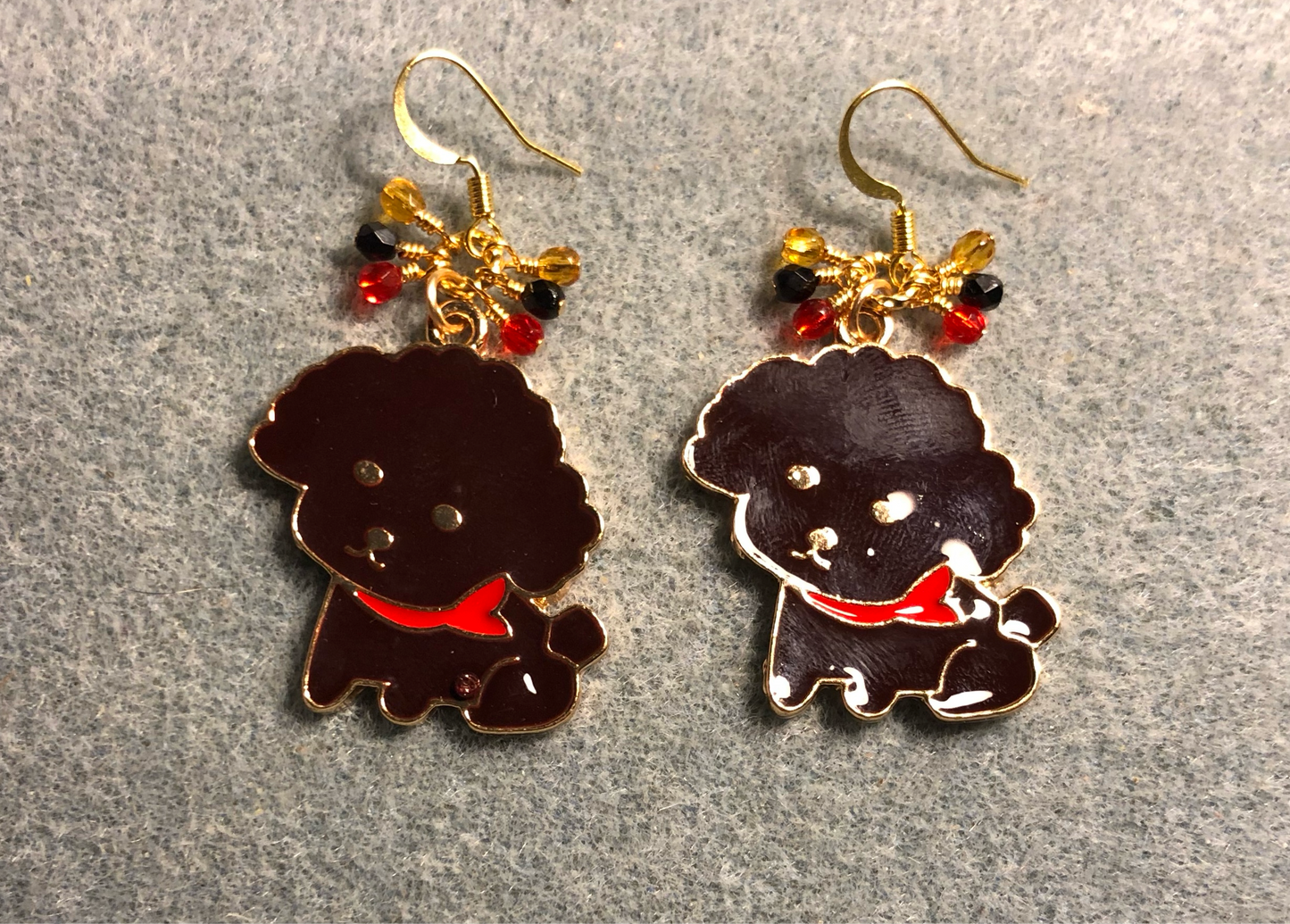 Large black and red enamel puppy dog charm earrings adorned with tiny dangling black, red, and amber Czech glass beads.