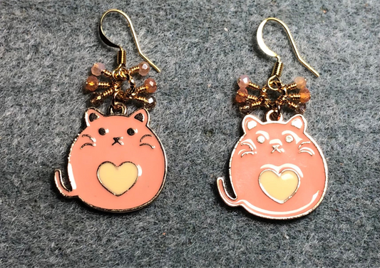 Peach and amber enamel fat cat charm earrings adorned with tiny dangling peach, amber, and gold Chinese crystal beads.