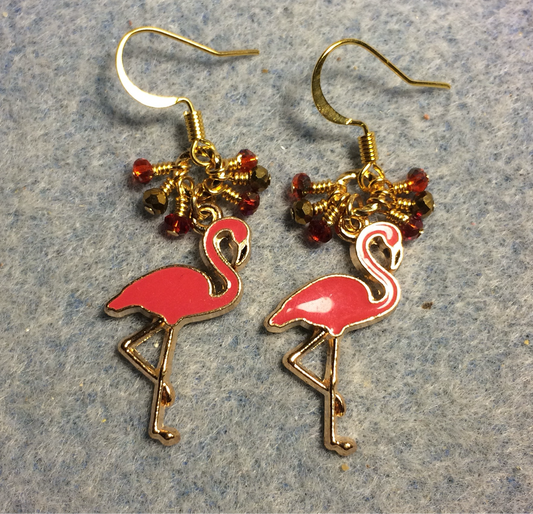 Reddish pink enamel flamingo charm earrings adorned with tiny dangling red and gold Chinese crystal beads.