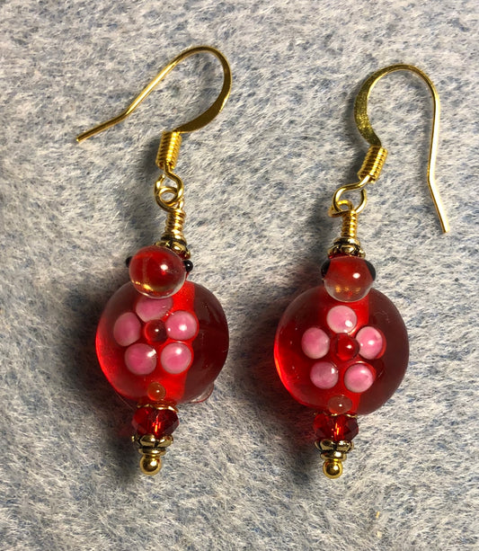 Red lamp work turtle bead earrings adorned with red Chinese crystal beads.