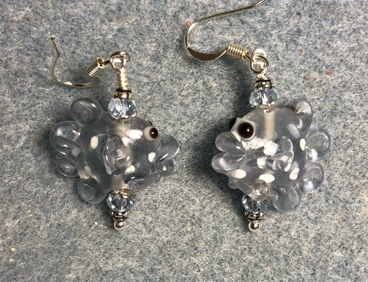 Light blue and white lamp work spotted fish bead earrings adorned with light blue Chinese crystal beads.