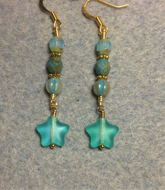 Small matte turquoise teal Czech glass star bead earrings adorned with turquoise teal Czech glass beads.