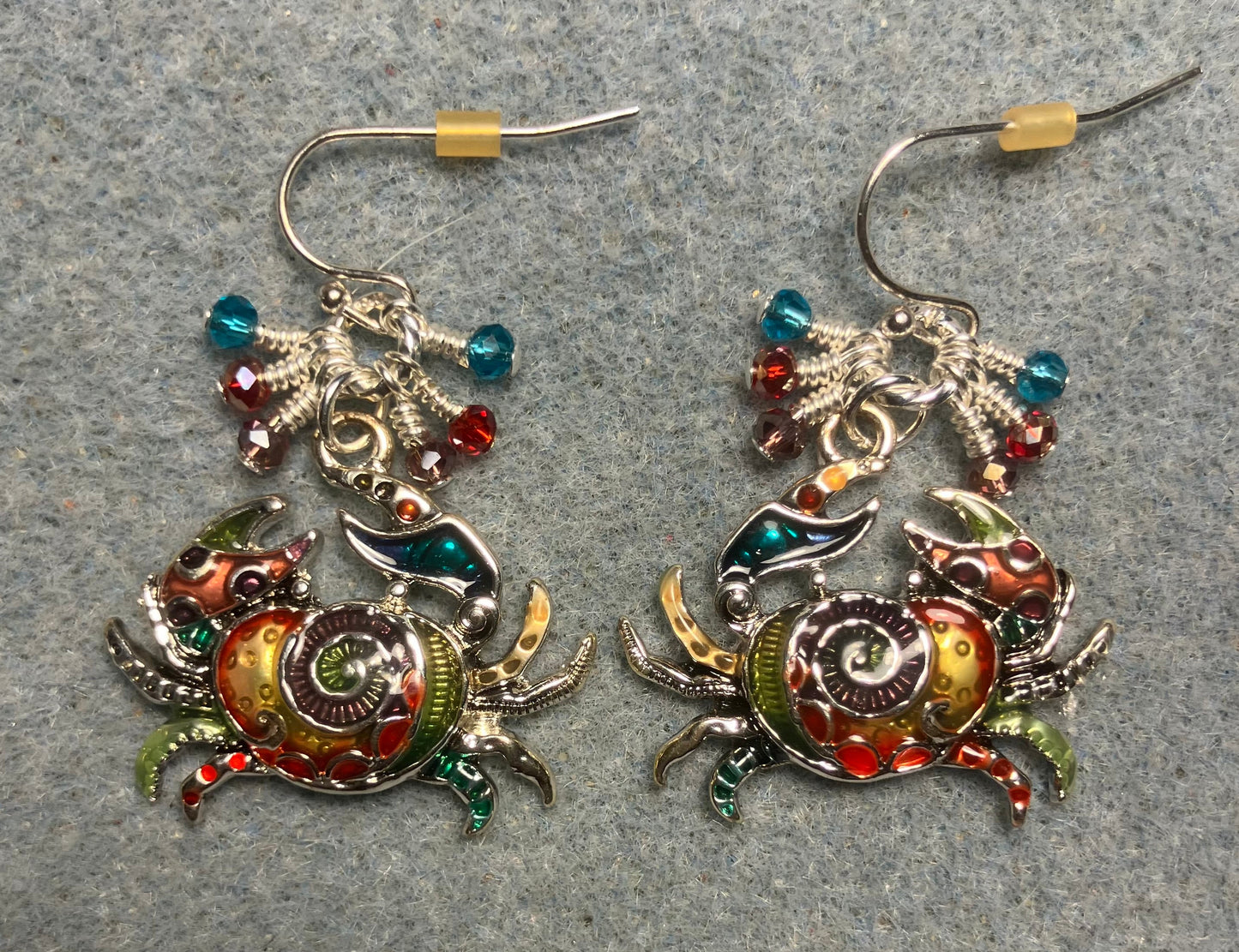 Silver and multicolored enamel crab charm earrings adorned with tiny dangling violet, red, and turquoise Chinese crystal beads.