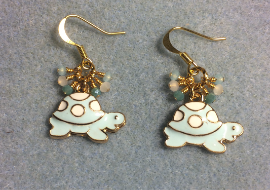 Light aqua and white enamel turtle charm earrings adorned with tiny dangling light aqua and white Chinese crystal beads.