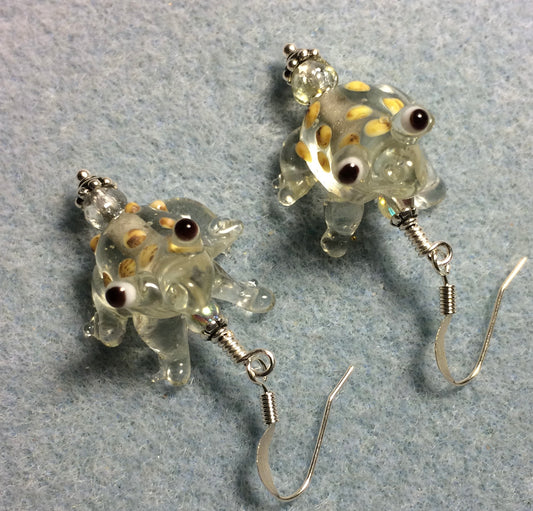 Clear lamp work spotted frog bead earrings adorned with clear Czech glass beads.