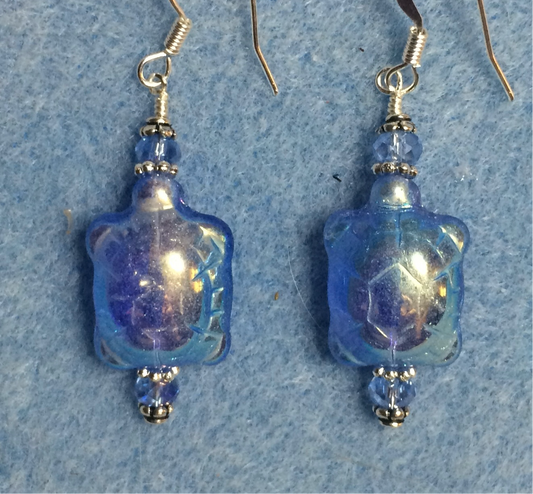 Iridescent light blue Czech glass turtle bead earrings adorned with light blue Chinese crystal beads.