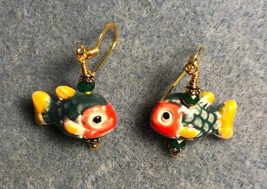 Small dark green, yellow, and red ceramic fish bead earrings adorned with dark green Chinese crystal beads.