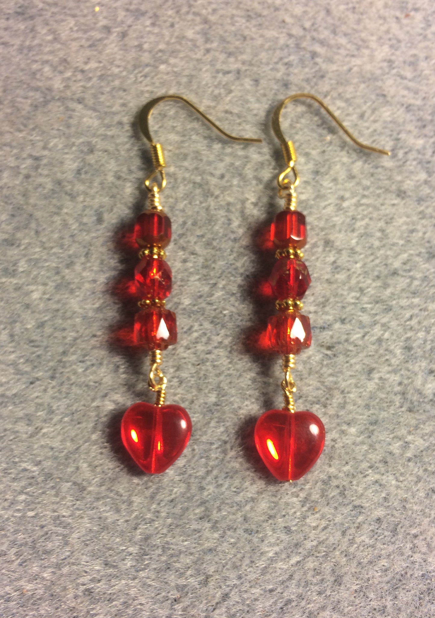 Small bright red Czech glass heart bead earrings adorned with red Czech glass beads.