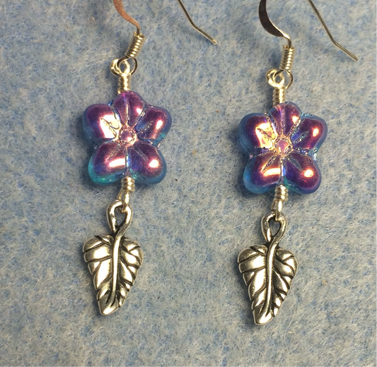 Sparkly purple Czech glass puffy flower bead earrings adorned with silver Tierracast leaf charms.