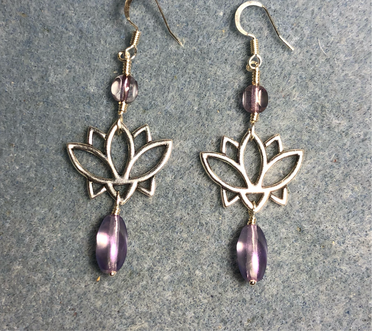 Silver lotus flower connector charm earrings adorned with metallic violet Czech glass drop beads and metallic violet Czech glass beads.