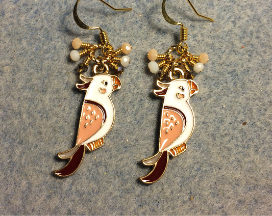 Brown, white, and peach enamel parrot charm earrings adorned with tiny dangling brown, white, and peach Chinese crystal beads.