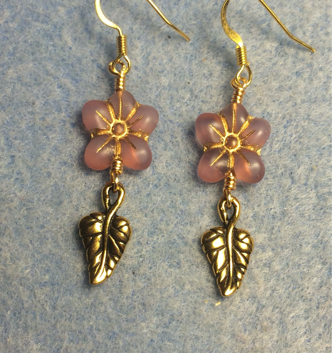 Opaque pink (with gold inlay) Czech glass puffy flower bead earrings adorned with gold Tierracast leaf charms.