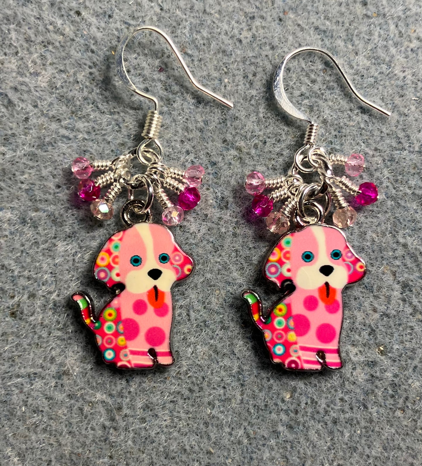 Pink and white enamel silly dog charm earrings adorned with tiny dangling hot pink and light pink Chinese crystal beads.