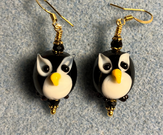 Black and white lamp work owl bead earrings adorned with black Chinese crystal beads.