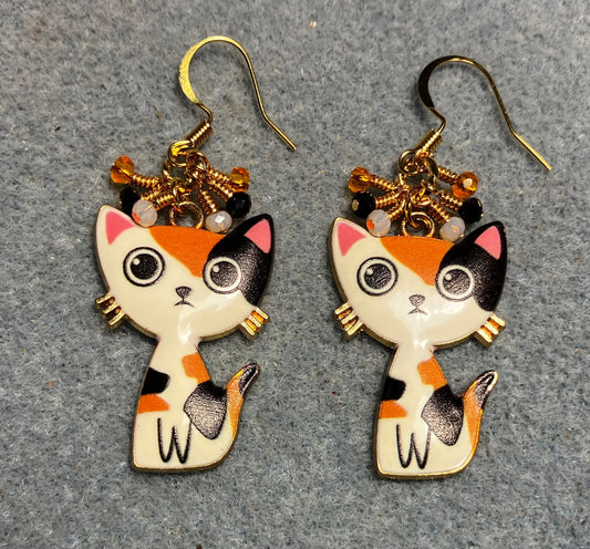 Orange, black, and white enamel calico cat charm earrings adorned with tiny dangling orange, black, and white Chinese crystal beads.