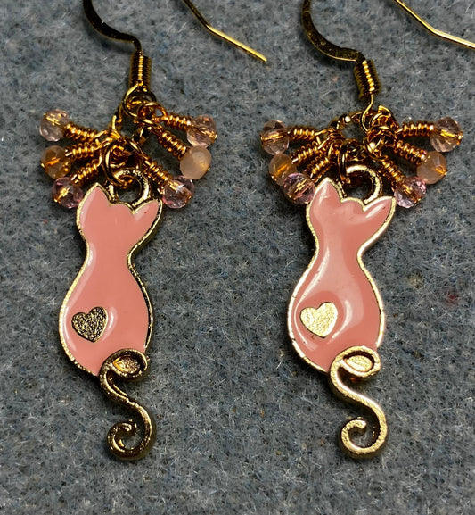 Small peach and gold enamel curly tailed cat charm earrings adorned with tiny dangling peach and pink Chinese crystal beads.
