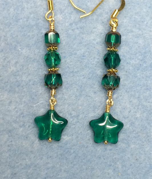 Small teal Czech glass star bead earrings adorned with teal Czech glass beads.