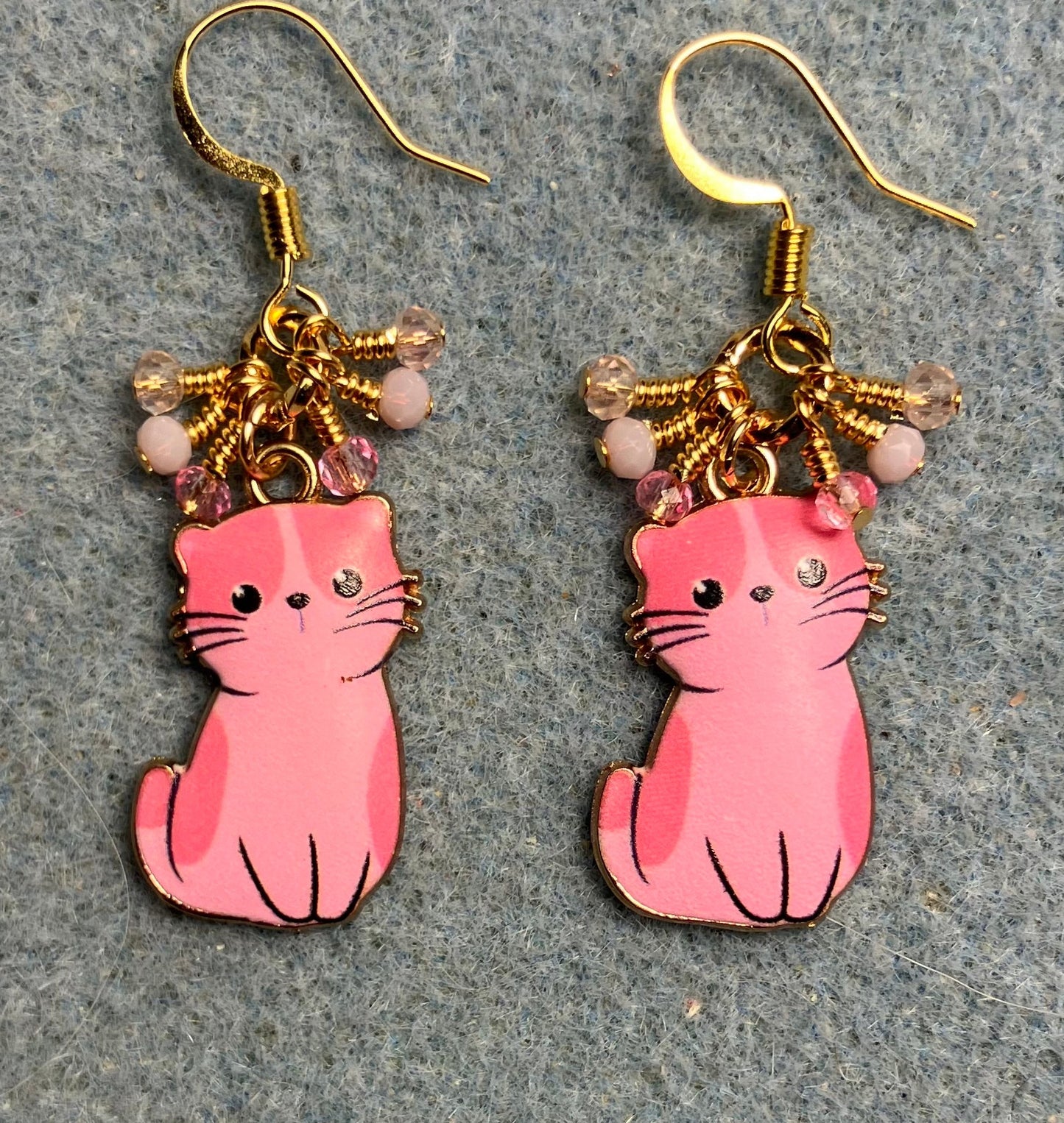 Pink enamel cat charm earrings adorned with tiny dangling pink Chinese crystal beads.