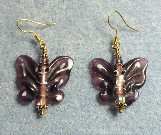 Purple lamp work butterfly bead earrings adorned with purple Czech glass beads.