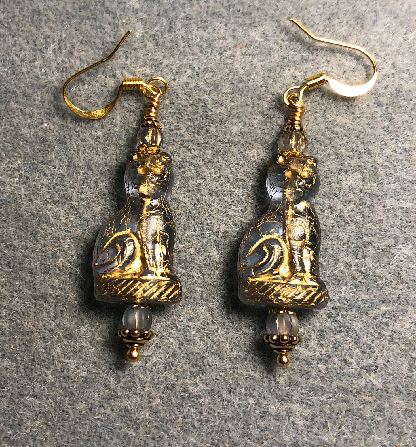 Translucent light blue (with gold inlay) fancy Czech glass cat bead earrings adorned with light blue Czech glass beads.