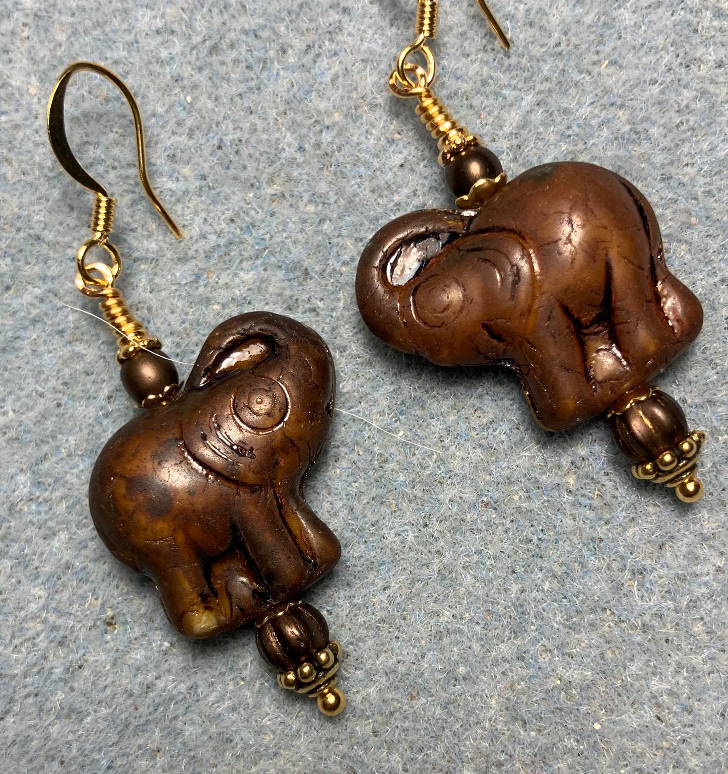Dark brown Czech glass elephant bead earrings adorned with dark brown Czech glass beads.