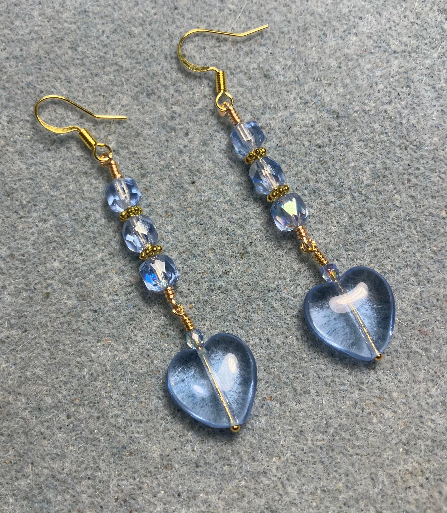 Light blue Czech glass heart bead earrings adorned with light blue Czech glass beads.