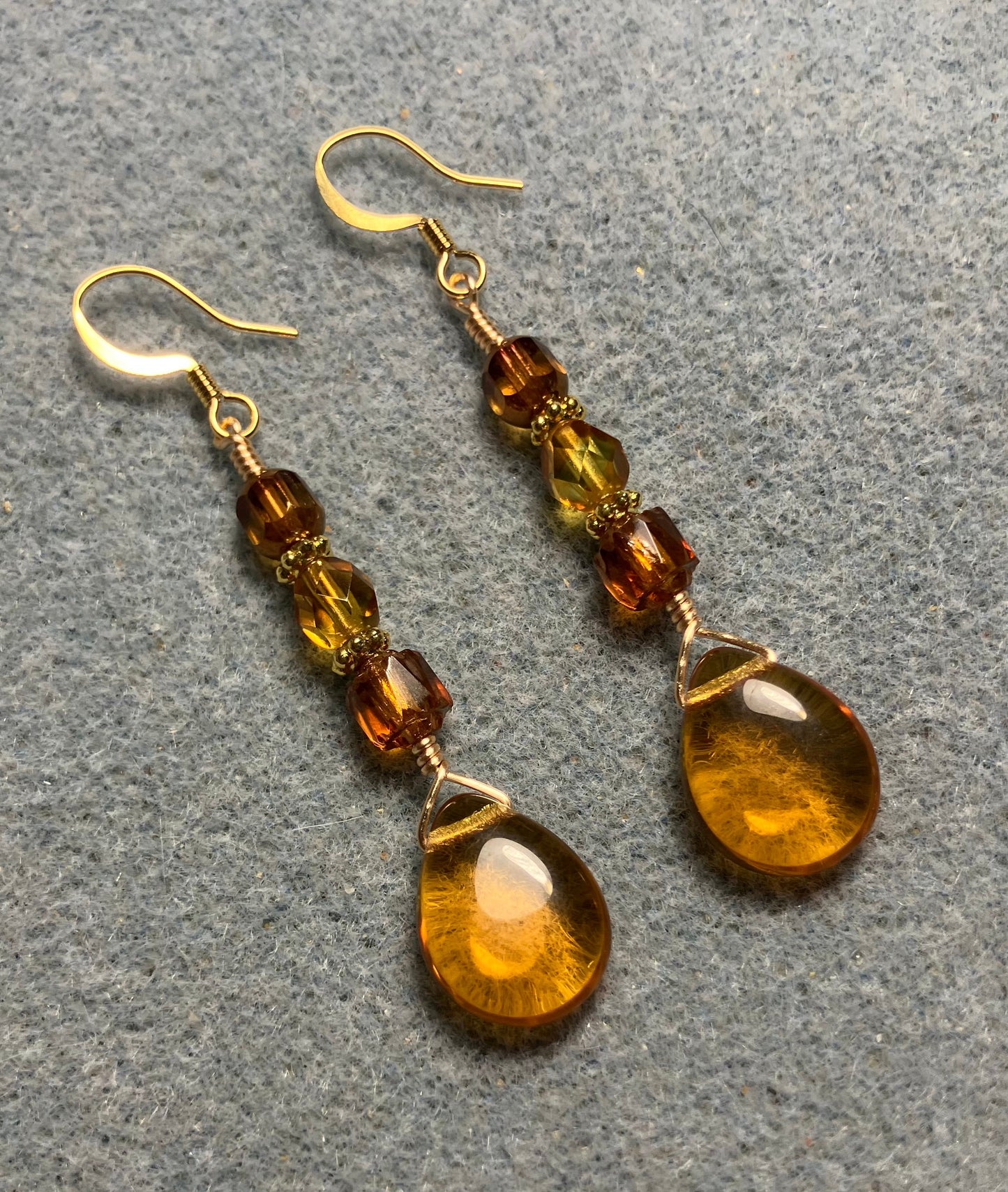Amber Czech glass pear drop bead earrings adorned with  amber Czech glass beads.