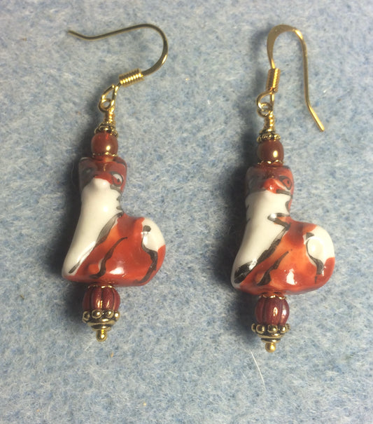 Orange red and white ceramic fox bead earrings adorned orange red Czech glass beads.