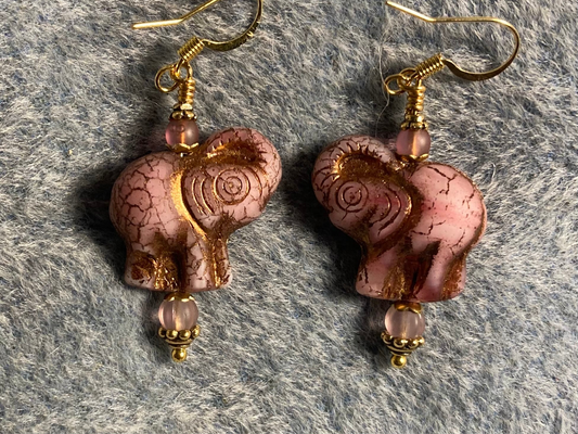 Pink (with gold inlay) Czech glass elephant bead earrings adorned with light pink glass beads.