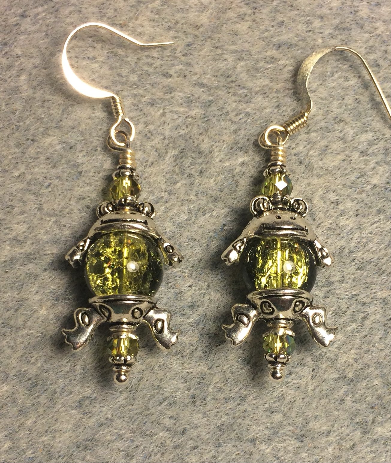 Silver frog earrings made with silver frog bead caps and large olive green Czech glass beads.