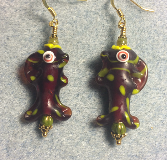 Brown and lime green lamp work fish bead earrings adorned with lime green Czech glass beads.