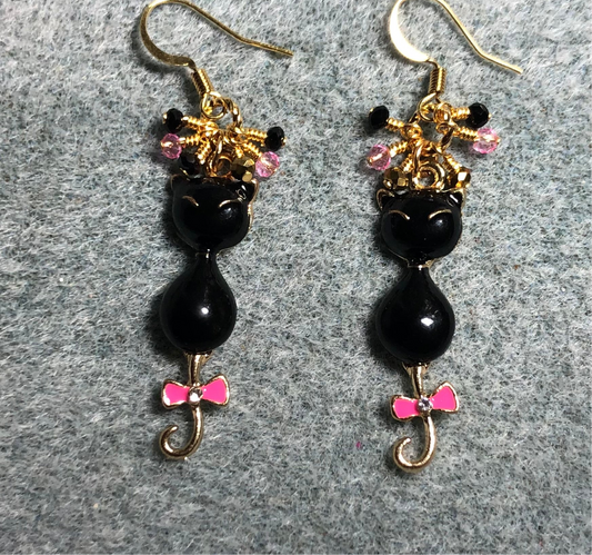 Black enamel long tailed cat charm earrings adorned with small dangling black, gold, and pink Chinese crystal beads.