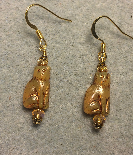 Small opaque topaz and gold Czech glass cat bead earrings adorned with topaz Chinese crystal beads.