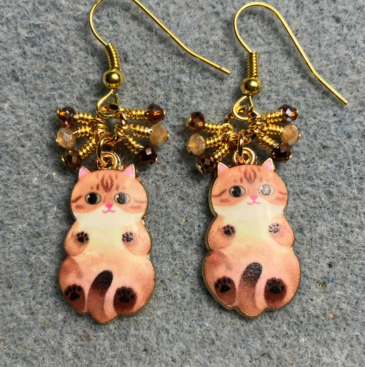 Brown and tan enamel cat charm earrings adorned with tiny dangling brown, tan, and amber Chinese crystal beads.