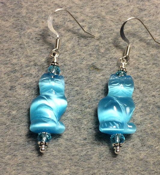 Turquoise fiber optic (cat’s eye) cat bead earrings adorned with turquoise Chinese crystal beads.