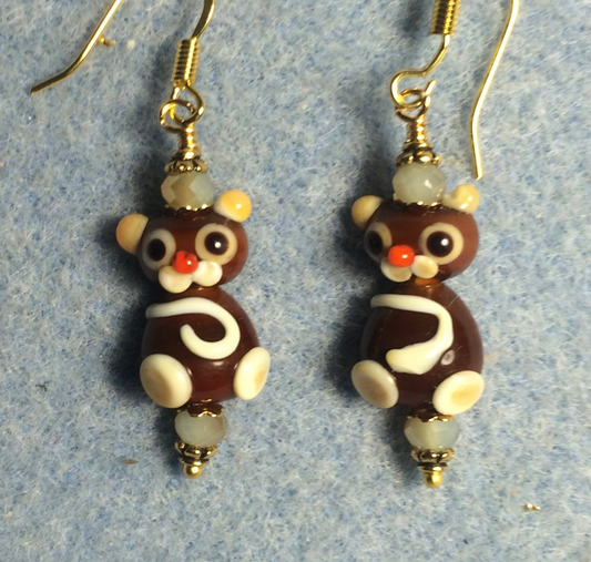 Small brown and white lamp work cat bead earrings adorned with tan Chinese crystal beads.