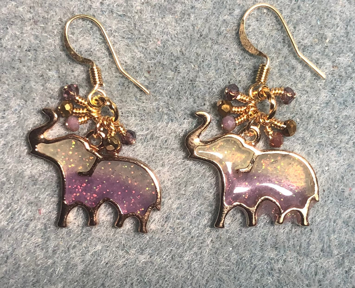 Purple and gold resin elephant charm earrings adorned with tiny dangling purple and gold Chinese crystal beads.