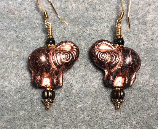 Opaque dark green (with copper inlay) Czech glass elephant bead earrings adorned with dark green Czech glass beads.