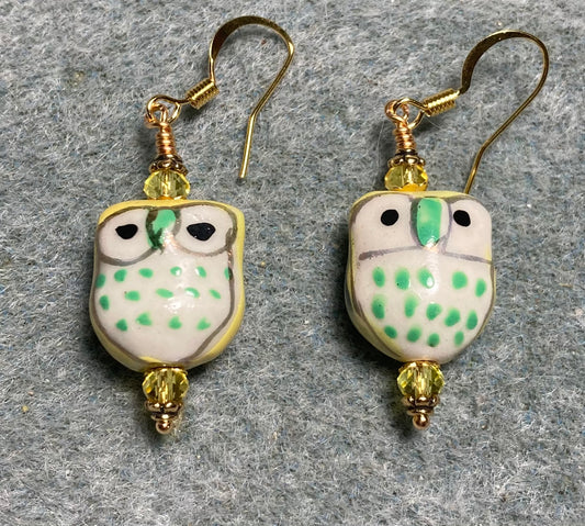 Yellow and green ceramic spotted owl bead earrings adorned with yellow Chinese crystal beads.