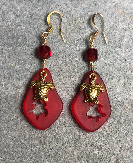 Red sea glass sea turtle pendant bead earrings adorned with gold sea turtle charms and red Czech glass beads.