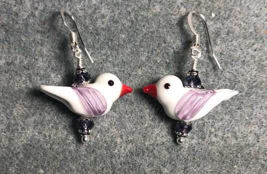 Opaque white and lavender lamp work songbird bead earrings adorned with lavender Chinese crystal beads.