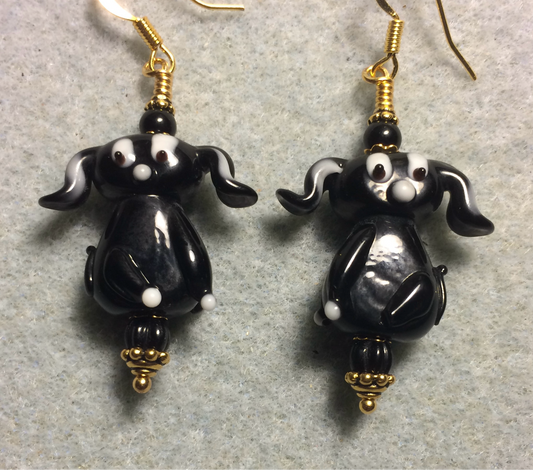 Opaque black lamp work floppy eared puppy dog bead earrings adorned with black Czech glass beads.
