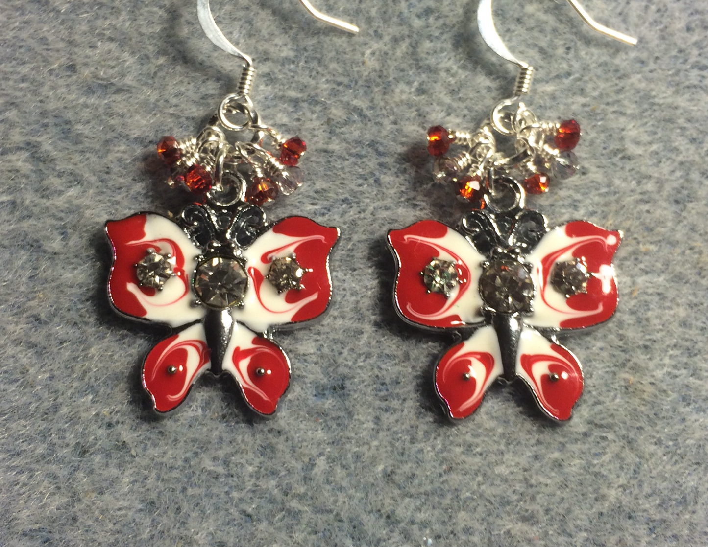 Vintage red and white enamel and rhinestone butterfly charm earrings adorned with tiny dangling red and clear Chinese crystal beads.