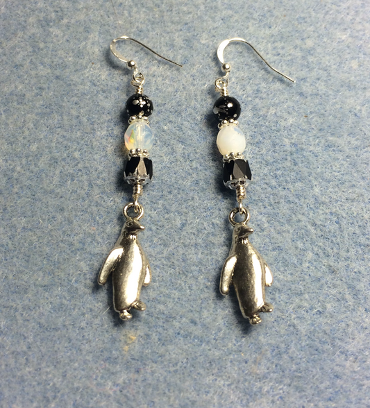 Silver penguin charm earrings adorned with black and white Czech glass beads