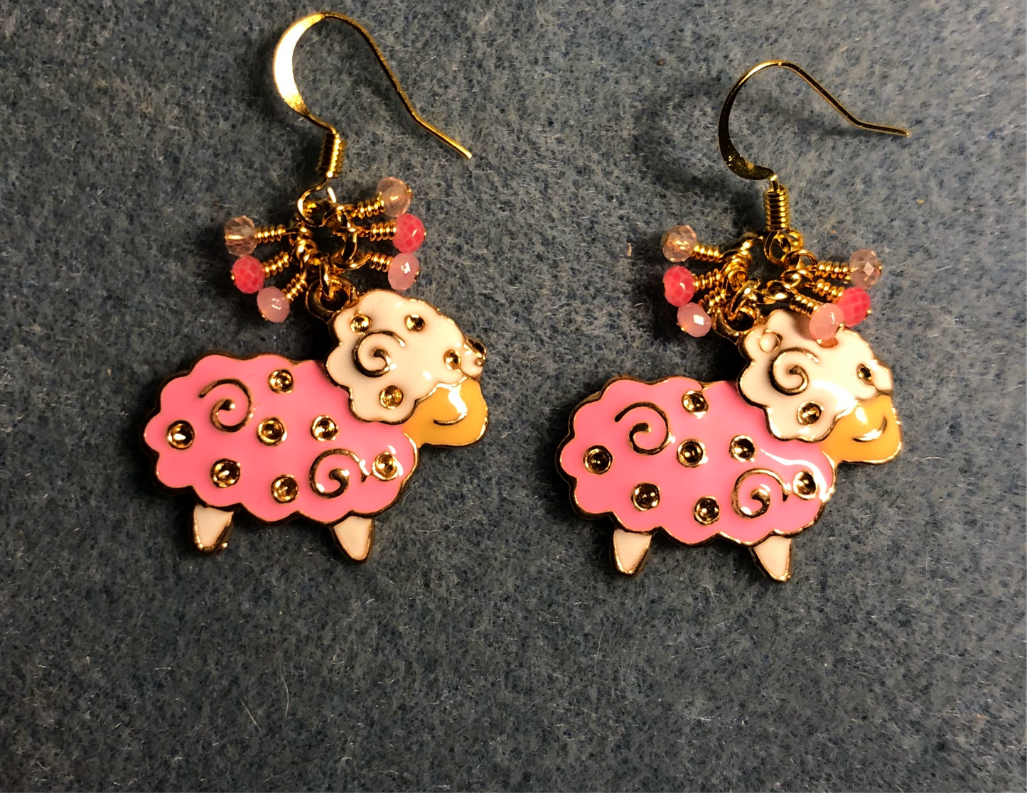 Pink, gold, and white enamel sheep charm earrings adorned with tiny dangling pink Chinese crystal beads.