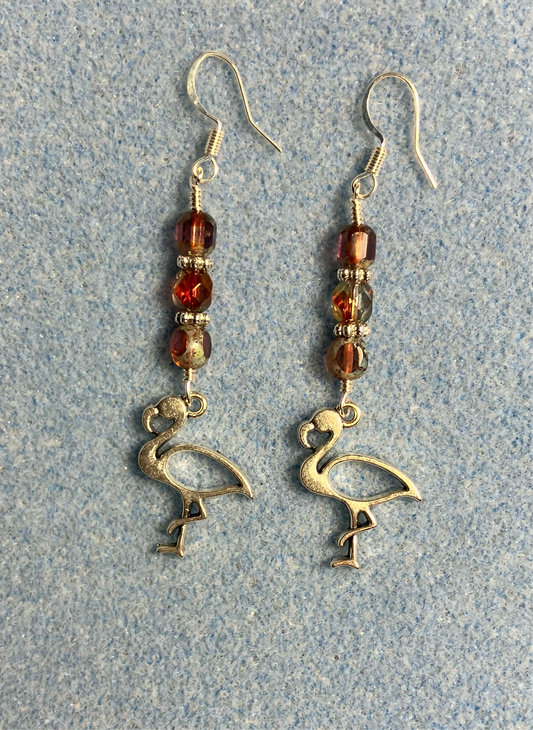 Silver flamingo charm earrings adorned with reddish pink Czech glass beads.