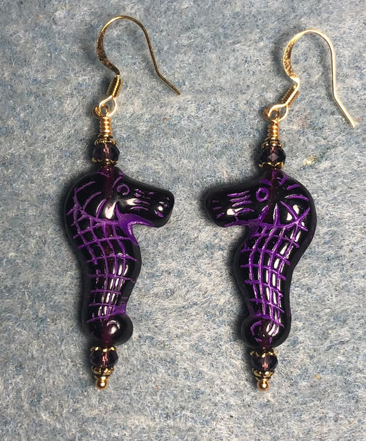 Dark purple (with violet inlay) Czech glass seahorse bead earrings adorned with purple Chinese crystal beads.