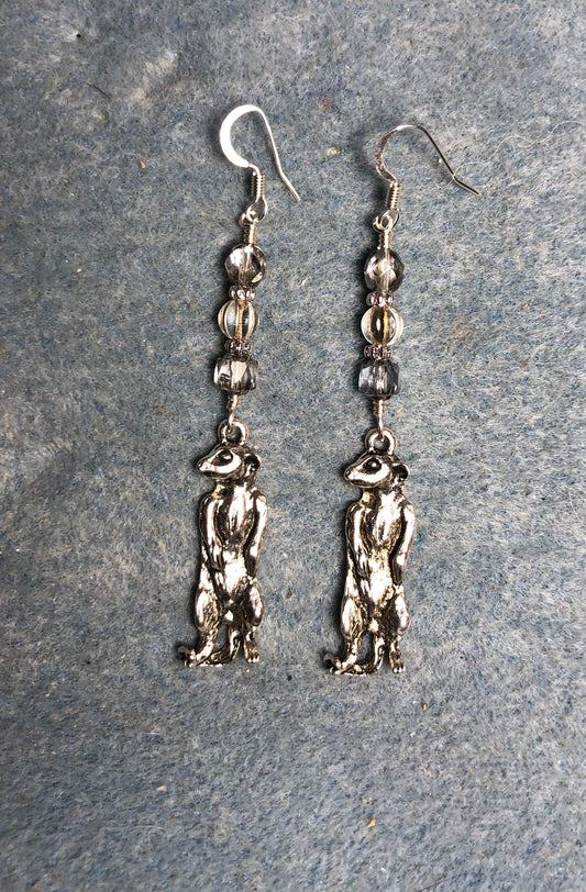Silver standing meercat charm earrings adorned with gray Czech glass beads